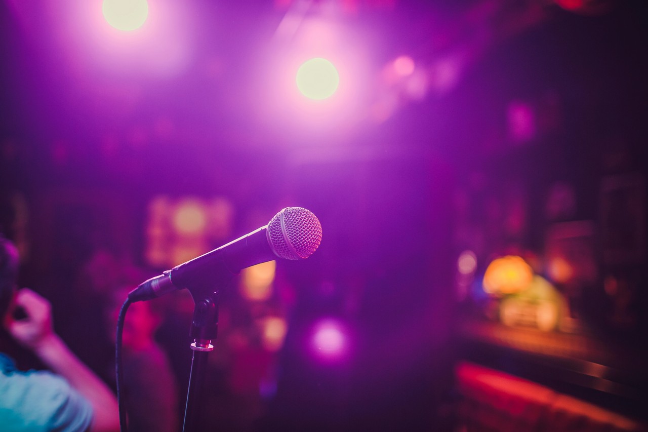 Live entertainment under stage lights — Friday nights at Palmwoods Community Club