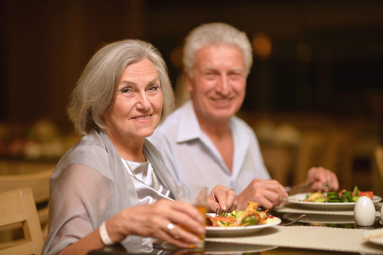 Couple enjoying a relaxed bistro lunch at Palmwoods Community Club